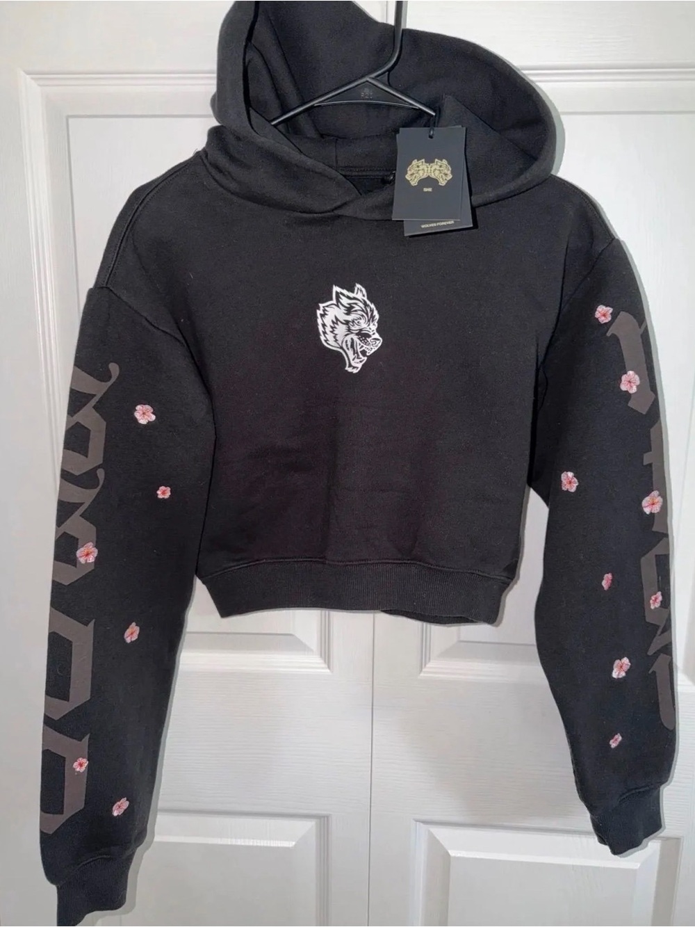 Black Cropped Hoodie Sweater with Wolf Emblem and Floral Sleeve Detail